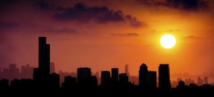 gw-impacts-setting-sun-and-city-skyline