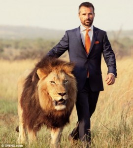 A poster showing Richardson walking beside a lion. Image source.