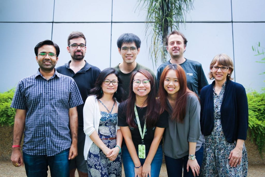 Johnathan posing with his lab mates. From left: (first row) Dr. Devendra Shivhare, Dr. Irene Julca, Ms. Beh Ing Tsyr, Ms. Tan Qiao Wen, Dr. Daniela Mutwil-Anderwald, (second row) Dr. Riccardo Delli Ponti, Johnathan Ng, Asst. Prof Marek Mutwil